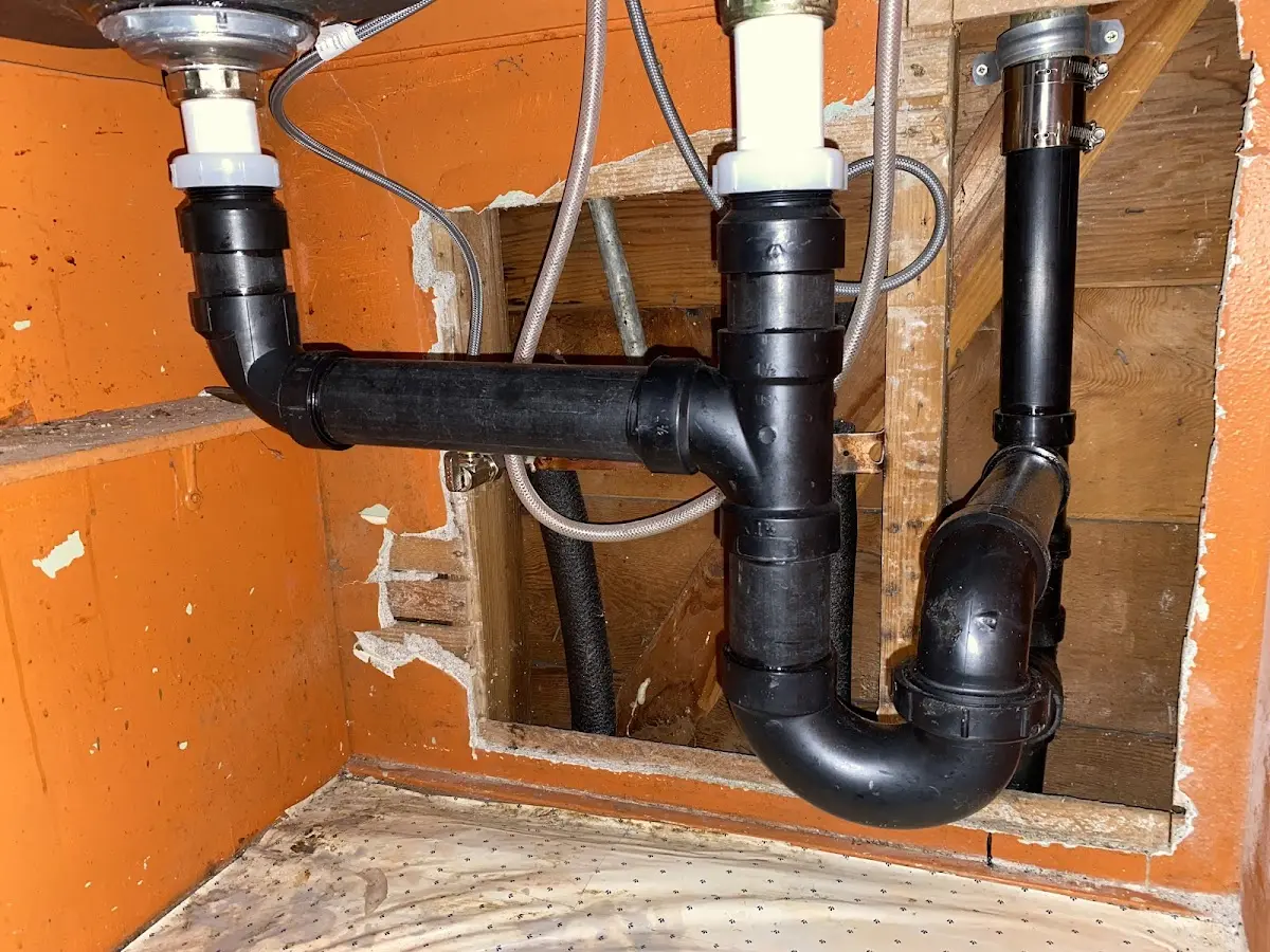 Professional Garbage Disposal Repair equipment and tools on the job in West Providence